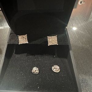 White gold diamond multistory princess cut earrings with screw back.